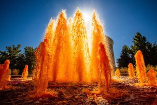 Alumni center fountain dyed orange for homecoming